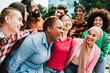 © Vane Nunes - Diverse group of friends having fun in city in summer day. Young people celebrate holiday vacations outside