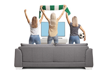 Wall Mural - Rear view shot of excited young female football fans cheering and watching tv