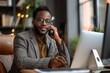 © fotofabrika - Professional Man Talking On Phone While Working At Desk In Office