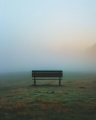 Canvas Print - A lonely bench sits in the middle of a foggy field. AI.