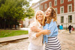 © maxbelchenko - Fashion portrait of two young women in summer sunny day  posing on the street. Concept of lifestyle, fashion, travel.