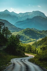 Wall Mural - Country road through lush forest, mountains backdrop Sunny day, inviting exploration nature's beauty