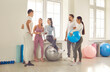 © Studio Romantic - Group of friends engaging in conversation after an workout at the gym. Smiles fill the air as they share fitness tips and stories, fostering a sense of community within the sports team.