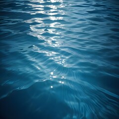 Rippling blue water surface with light reflections
