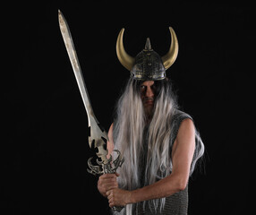 Wall Mural - portrait of a male Viking warrior on a black background