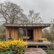 © Sekai - Another Homely View: Wooden Cabin with Sprawling Yellow Forsythia
