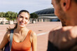 © Xavier Lorenzo - Two young happy sportive friends hanging out after workout routine outdoor. Sport and friendship concept