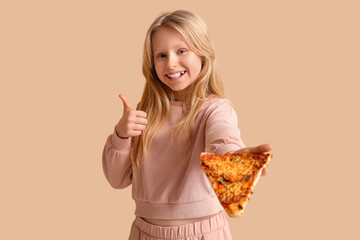 Canvas Print - Cute little girl with tasty pizza showing thumb-up gesture on color background