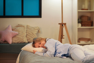 Wall Mural - Adorable girl sleeping on cozy bed