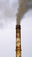 Wall Mural - Old pipes with massive smoke in the sky. Dangerous emissions going up in the air. Pollution of the environment. Ecological problems. Vertical video