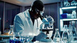 © InfinitiDesigns - Black scientist using a microscope to analyze a test sample in a state-of-the-art medical science laboratory advanced biotechnology tools bright and clean setting detailed and realistic