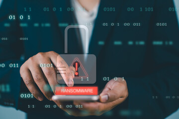 Fototapete - Malware attack virus alert. Person use smartphone with virtual warning sign with ransomware word. Warning notification, Cyber threats.