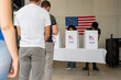 © Alan - people waiting in line queue for voting registration in the US election polling place