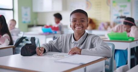 Canvas Print - African boy, face and happy in classroom with creative learning, skills development or coloring for school activity at desk. Portrait of smart and confident student laughing and excited for education