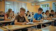 © kimly - Teenagers studying and preparing for exams in a classroom at summer school.