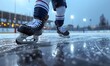 © Lucianastudio - A hockey player's legs and skates gliding on ice, with the rink in the background