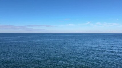 Wall Mural - calm blue ocean water and sky.