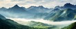 © robertuzhbt89 - Panoramic Mountain Range with Misty Valleys