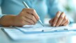 © Tonton1541 - Close-up of hands writing on a document, focusing on detailed paperwork with a pen. Perfect for business, administration, or office stock photos.