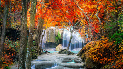 Wall Mural - Amazing in nature, beautiful waterfall at colorful autumn forest in fall season	