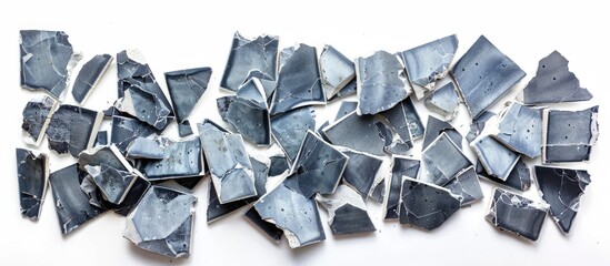 fragments of broken ceramic tiles of gray-blue color in a check on a white isolated background. with copy space image. Place for adding text or design