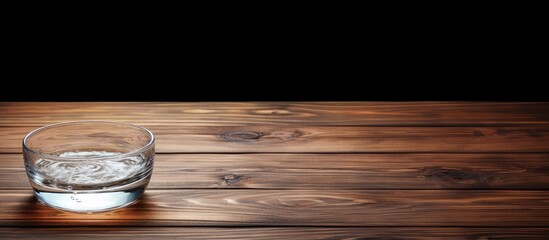 Leinwandbilder - Wooden table with a bowl of transparent water displayed, allowing for text in the copy space image.