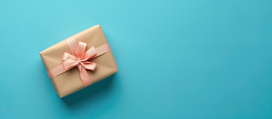 Poster - Gift box viewed from above on a blue background with copy space image.