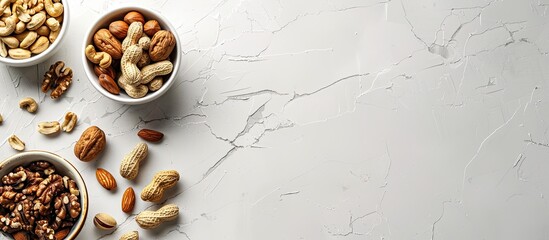 Poster - White table with an overhead view displaying a variety of nuts, creating a healthy snack concept with space for text or images. copy space available