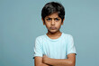 © Neha - Indian boy with arms crossed giving upset expression