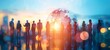 © saichon - A group of business people stand in front of a world globe on a digital blue and light grey gradient background with sun rays shining through.