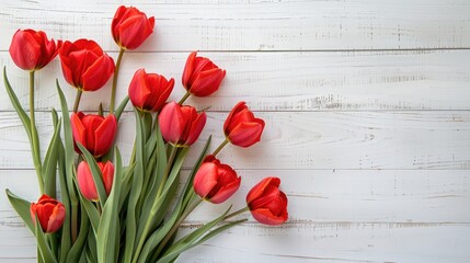 Wall Mural - Mother s Day background with red tulips on white wooden surface view from above