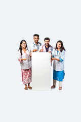 Wall Mural - Indian asian young doctors in uniform holding blank white board or placard