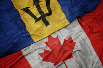 Wall Mural - waving colorful flag of barbados and national flag of canada on the dollar money background. finance concept.
