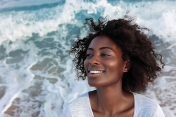 Wall Mural - Portrait of a blissful afro-american woman in her 30s dressed in a casual t-shirt in crashing waves background