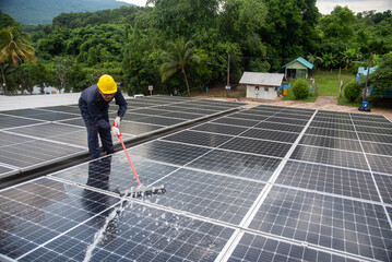 Wall Mural - cleaning staff Solar panels are making up the photovoltaic system on the roof.