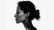 © Enrique - Black and white photo of side profile portrait of a woman, seamless white background, high contrast