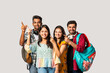 © StockImageFactory - Indian asian college student against white pointing or advertising at blank copy space