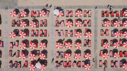 Red Umbrellas In the Beach Aerial