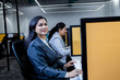 © GAJENDRRA BHATI  - Young indian professional woman sitting at desk working in corporate office. workplace and business concept.