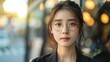 © PeopleWorker - A beautiful korean businesswoman wearing glasses with a fit body and sleek clothes