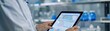 © Kanin - Doctor using a tablet for medical data analysis in a modern laboratory setting, showcasing advanced healthcare technology applications.