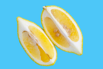 Wall Mural - Fresh lemon slices on blue background.