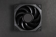 © eliosdnepr - Black cooler for computer or cooling system, CPU fan on dark background