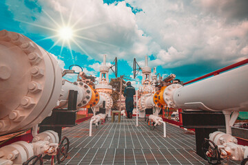 Wall Mural - Male worker inspection at steel long pipes and pipe elbow in station oil factory during refinery valve of visual check record pipeline tank