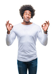 Wall Mural - Afro american man over isolated background relax and smiling with eyes closed doing meditation gesture with fingers. Yoga concept.