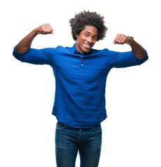 Canvas Print - Afro american man over isolated background showing arms muscles smiling proud. Fitness concept.