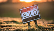 © hardvicore - Sign with text SOLD on green lawn. Sold plot of land. Private property.