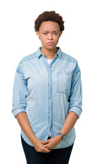 Sticker - Young beautiful african american woman over isolated background skeptic and nervous, frowning upset because of problem. Negative person.