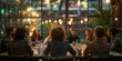 © tino - A group of people are gathered around a table in a lively restaurant, enjoying each others company and the vibrant atmosphere