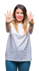 Canvas Print - Young beautiful woman casual white t-shirt over isolated background showing and pointing up with fingers number nine while smiling confident and happy.